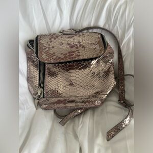 Giuseppe Zanotti mini backpack in a lavender color.